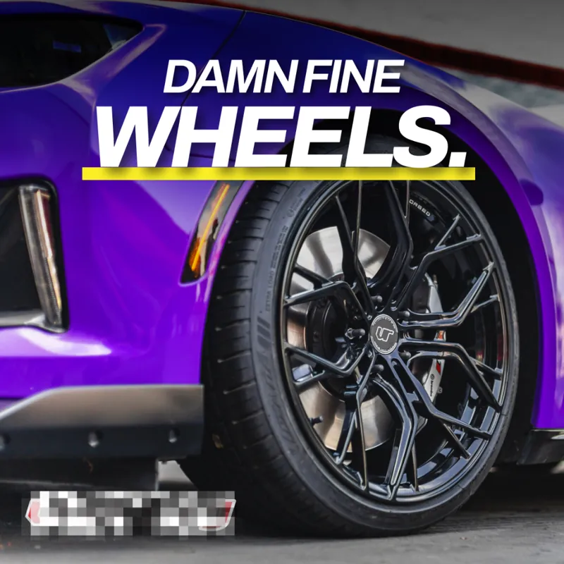 Ad: a black multi-spoke wheel on a purple car with the line 'Damn fine wheels'